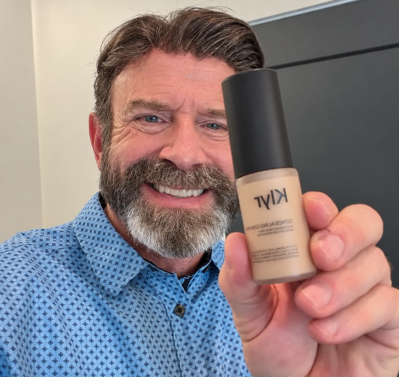 AI-generated model holding Klyr Skin Corrector Pro. Not the reviewer.